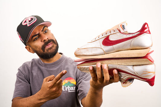 Vick Almighty holding restored Nike Night Track sneaker